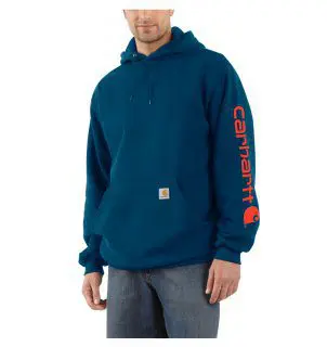 A man wearing a blue hoodie with red lettering.