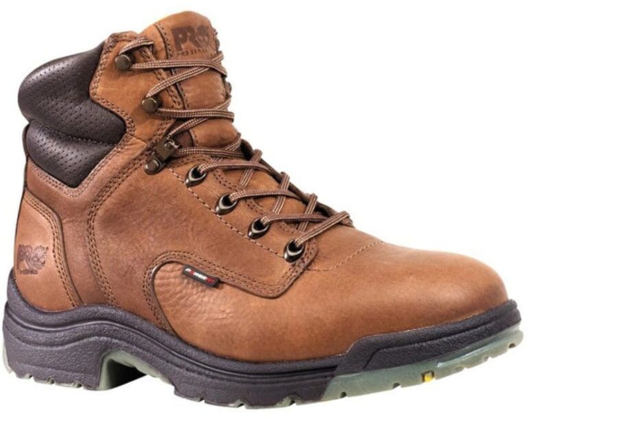 A brown work boot with black laces and a black sole.
