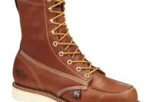 A brown work boot with white sole and tan laces.